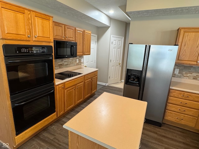 14520 Brackney Ln, Carmel, IN 46032 - kitchen with black appliances, tasteful backsplash, dark wood finished floors, light countertops, and recessed lighting