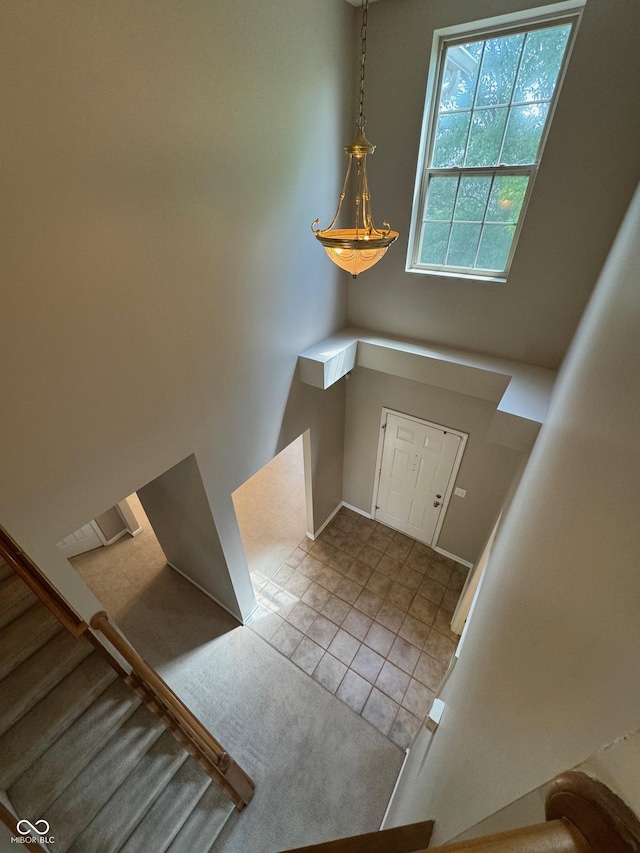 14520 Brackney Ln, Carmel, IN 46032 - tiled entrance foyer with stairway and baseboards