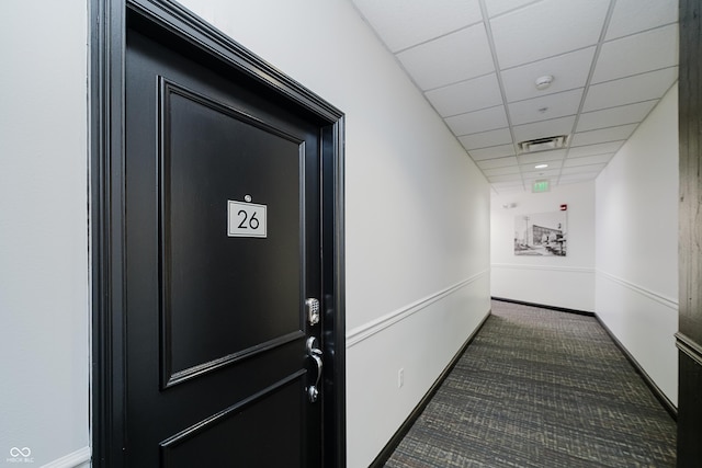 624 E Walnut St Unit 26, Indianapolis, IN 46204 - hallway with dark colored carpet and a drop ceiling