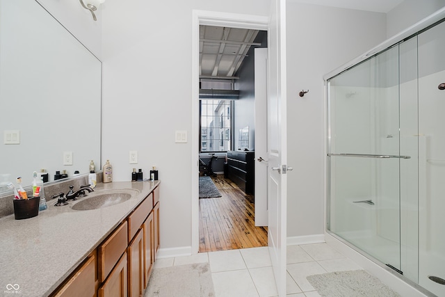 624 E Walnut St Unit 26, Indianapolis, IN 46204 - full bathroom with a stall shower, vanity, and tile patterned floors