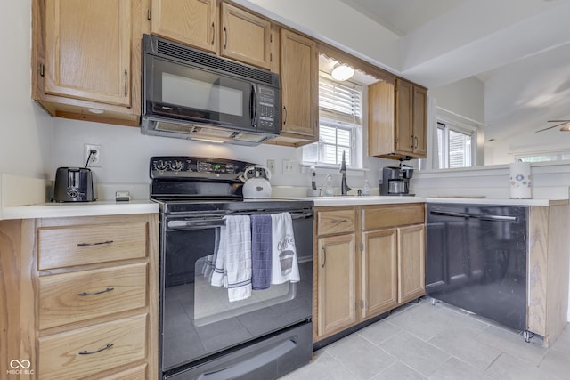 9676 Spruce Ln, Fishers, IN 46038 - kitchen with black appliances, light tile patterned floors, light countertops, and a peninsula
