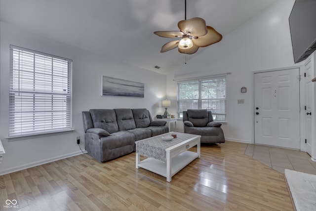 9676 Spruce Ln, Fishers, IN 46038 - living room featuring light wood finished floors, ceiling fan, and high vaulted ceiling