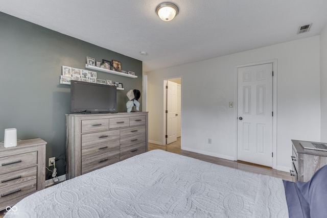 9676 Spruce Ln, Fishers, IN 46038 - bedroom featuring wood finished floors and baseboards
