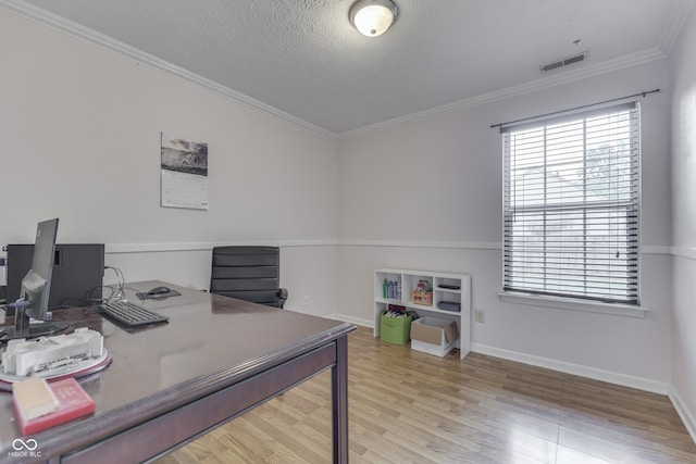 9676 Spruce Ln, Fishers, IN 46038 - office area with wood finished floors, ornamental molding, and a textured ceiling