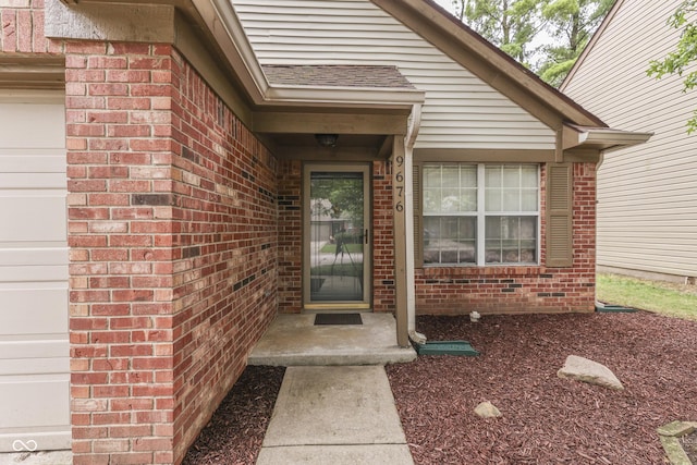 9676 Spruce Ln, Fishers, IN 46038 - entrance to property featuring brick siding and a garage