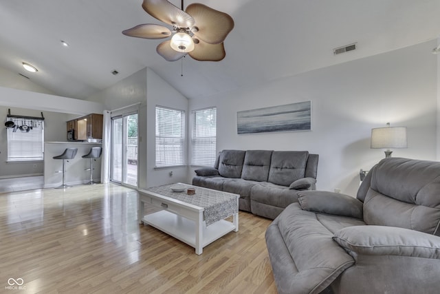 9676 Spruce Ln, Fishers, IN 46038 - living room featuring lofted ceiling, a ceiling fan, and light wood finished floors