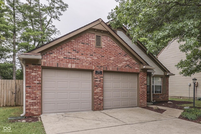 9676 Spruce Ln, Fishers, IN 46038 - single story home featuring brick siding, concrete driveway, and an attached garage
