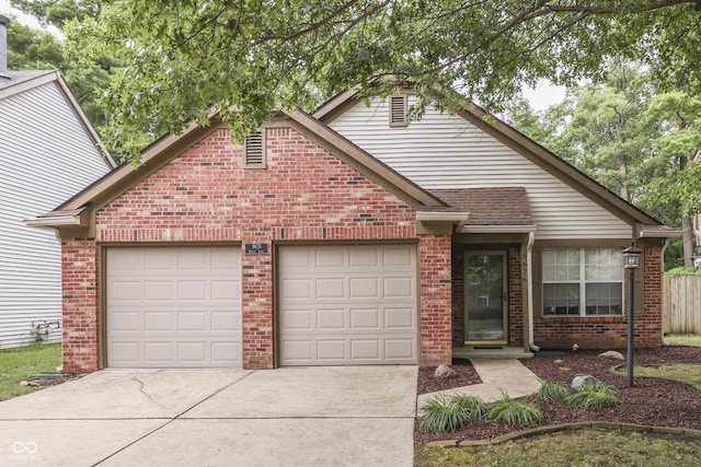 9676 Spruce Ln, Fishers, IN 46038 - view of front of property with brick siding, concrete driveway, and a garage