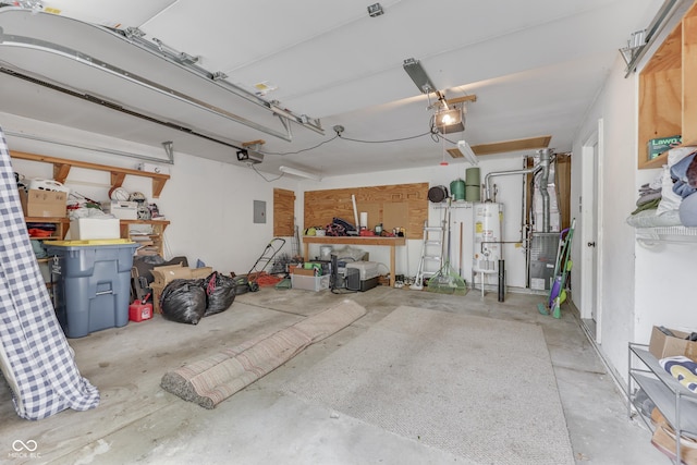 9676 Spruce Ln, Fishers, IN 46038 - garage featuring water heater, a garage door opener, and electric panel