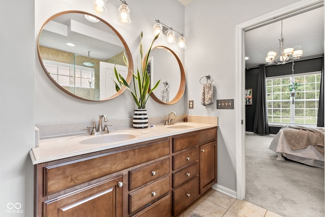 13816 Ambria Dr, Mccordsville, IN 46055 - ensuite bathroom with double vanity, a chandelier, and tile patterned floors