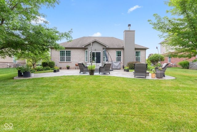 13816 Ambria Dr, Mccordsville, IN 46055 - rear view of property featuring a patio, brick siding, a chimney, and an outdoor living space