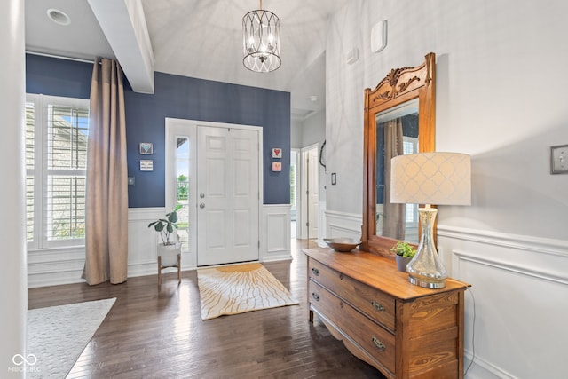 13816 Ambria Dr, Mccordsville, IN 46055 - entrance foyer with healthy amount of natural light, wainscoting, dark wood finished floors, and a chandelier