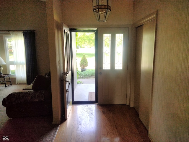 4008 Washington St, Columbus, IN 47203 - foyer entrance with wood finished floors and a chandelier