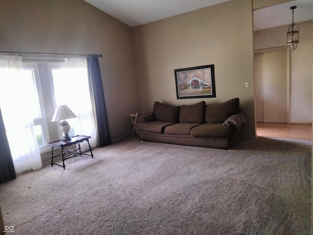 4008 Washington St, Columbus, IN 47203 - carpeted living area featuring lofted ceiling