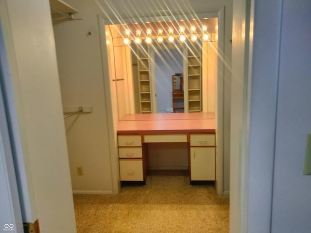 4008 Washington St, Columbus, IN 47203 - walk in closet with light carpet and built in desk