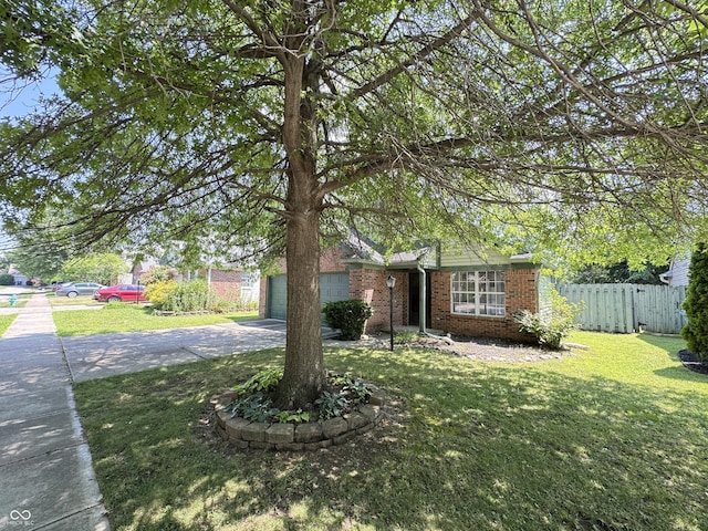 9716 Spruce Ln, Fishers, IN 46038 - view of front of property with concrete driveway, brick siding, and an attached garage
