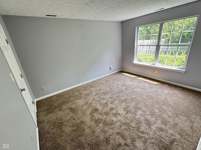 9716 Spruce Ln, Fishers, IN 46038 - carpeted empty room featuring a textured ceiling and baseboards