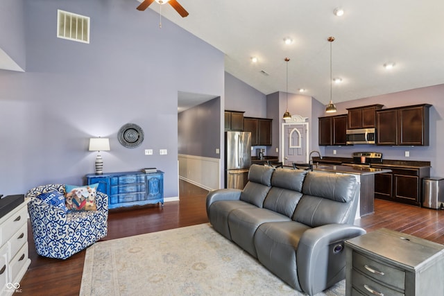 897 Sommersweet Run, Greenwood, IN 46143 - living room with high vaulted ceiling, a ceiling fan, and dark wood-type flooring
