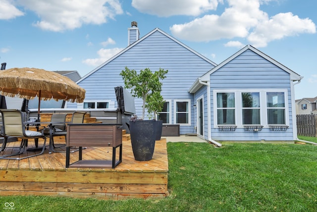 897 Sommersweet Run, Greenwood, IN 46143 - rear view of house featuring a wooden deck, a chimney, and outdoor dining space
