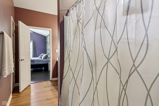 897 Sommersweet Run, Greenwood, IN 46143 - bathroom with wood finished floors and a shower with shower curtain