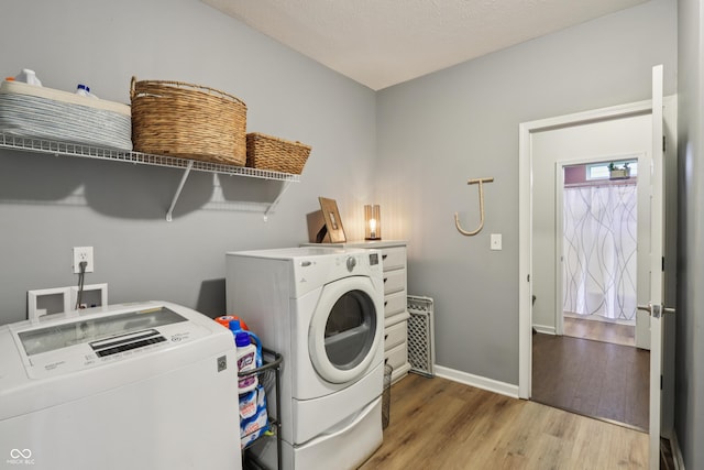 897 Sommersweet Run, Greenwood, IN 46143 - washroom featuring washer and clothes dryer and wood finished floors