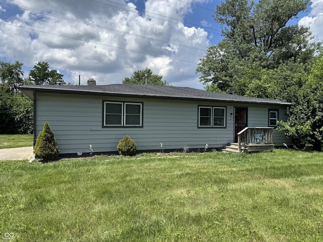 4006 Kenneth Ave, Indianapolis, IN 46226 - back of house featuring a yard and a chimney