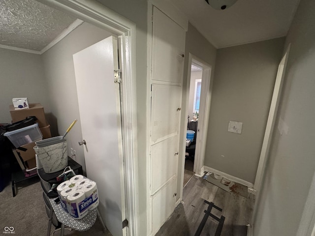 4006 Kenneth Ave, Indianapolis, IN 46226 - corridor with wood finished floors, crown molding, and a textured ceiling