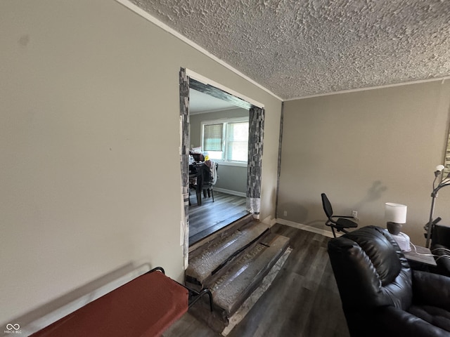 4006 Kenneth Ave, Indianapolis, IN 46226 - living room featuring wood finished floors, a textured ceiling, and crown molding