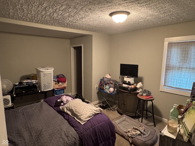 4006 Kenneth Ave, Indianapolis, IN 46226 - carpeted bedroom with a textured ceiling and baseboards