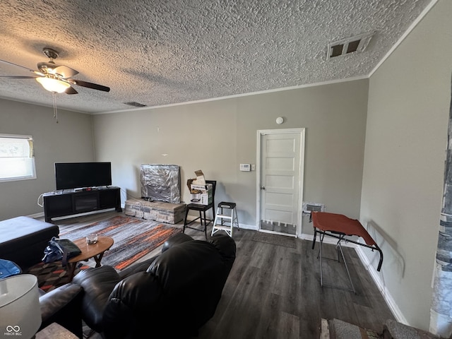 4006 Kenneth Ave, Indianapolis, IN 46226 - living room featuring a textured ceiling, wood finished floors, a ceiling fan, and crown molding