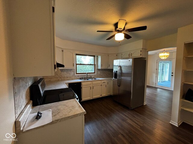 321 S Locust Dr, Morristown, IN 46161 - kitchen featuring stainless steel fridge, black / electric stove, light countertops, and dark wood finished floors