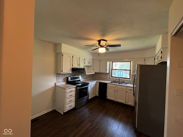 321 S Locust Dr, Morristown, IN 46161 - kitchen with appliances with stainless steel finishes, dark wood-type flooring, white cabinets, decorative backsplash, and a textured ceiling