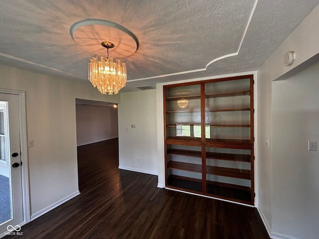 321 S Locust Dr, Morristown, IN 46161 - unfurnished dining area featuring wood finished floors, a chandelier, and a textured ceiling