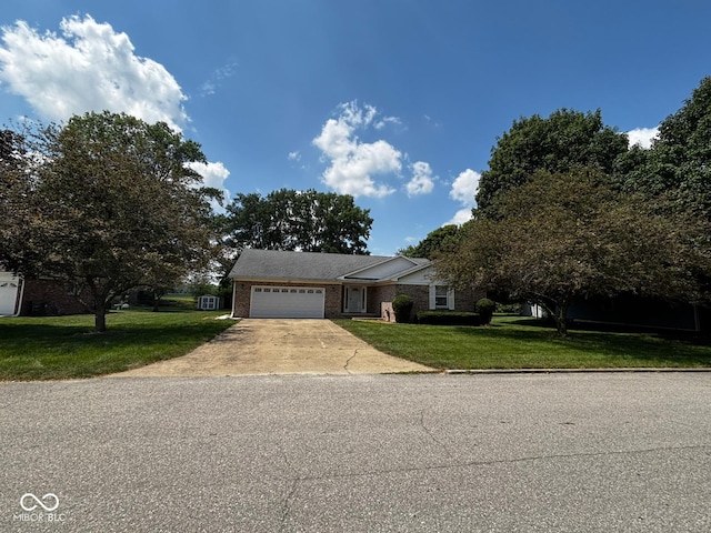 321 S Locust Dr, Morristown, IN 46161 - view of front facade featuring an attached garage, concrete driveway, a front lawn, and brick siding