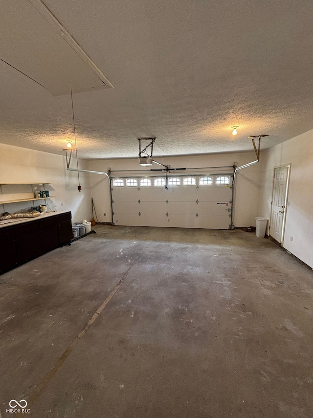 321 S Locust Dr, Morristown, IN 46161 - garage featuring a garage door opener