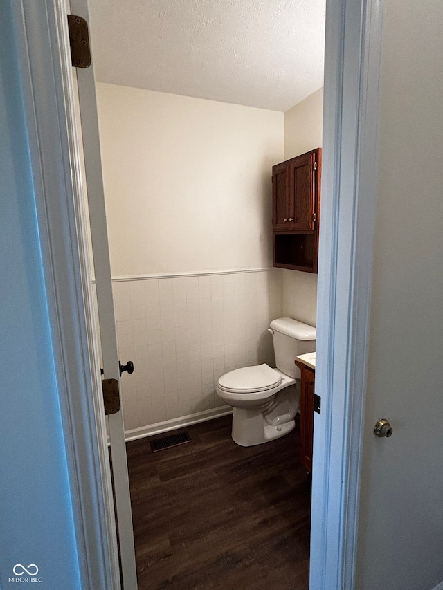 321 S Locust Dr, Morristown, IN 46161 - half bathroom with wood finished floors, wainscoting, and vanity
