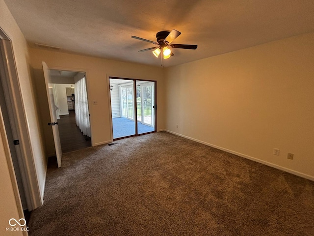 321 S Locust Dr, Morristown, IN 46161 - empty room featuring a ceiling fan and dark carpet
