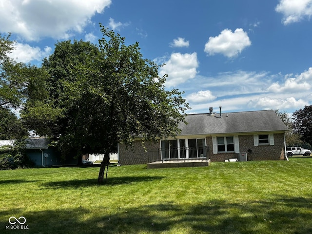 321 S Locust Dr, Morristown, IN 46161 - back of property with brick siding and a lawn