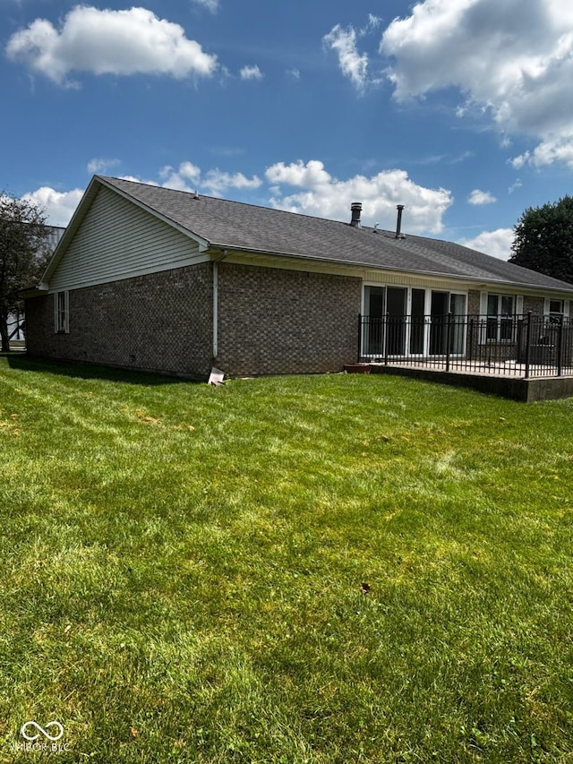 321 S Locust Dr, Morristown, IN 46161 - view of side of home with brick siding and a yard