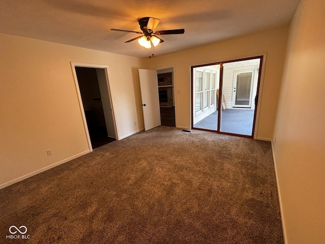 321 S Locust Dr, Morristown, IN 46161 - unfurnished bedroom featuring access to exterior, carpet, and a ceiling fan