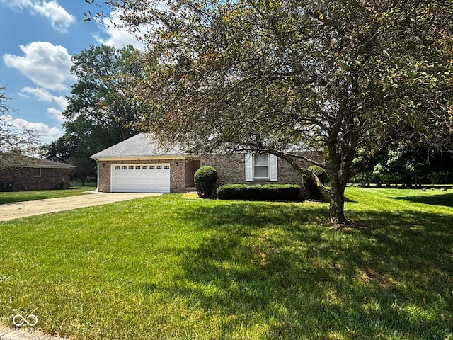 321 S Locust Dr, Morristown, IN 46161 - view of front of home with driveway, a garage, a front yard, and brick siding