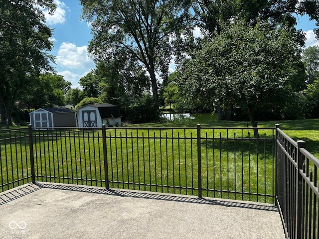 321 S Locust Dr, Morristown, IN 46161 - exterior space with a storage unit, a water view, and view of wooded area