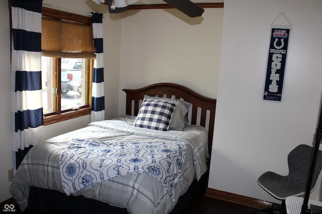 6022 S 550th Rd E, Franklin, IN 46131 - bedroom featuring wood finished floors and ceiling fan