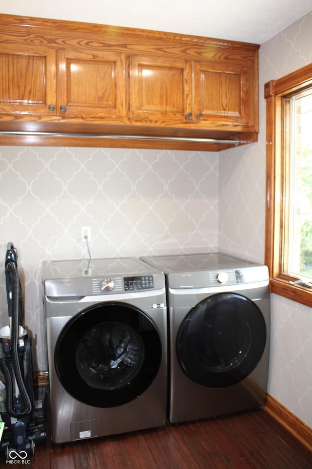 6022 S 550th Rd E, Franklin, IN 46131 - laundry area with cabinet space, washing machine and clothes dryer, dark wood-style floors, wallpapered walls, and healthy amount of natural light
