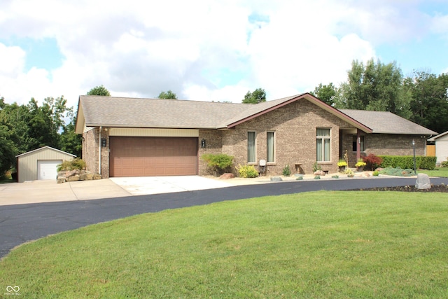 6022 S 550th Rd E, Franklin, IN 46131 - ranch-style home with a front yard, brick siding, roof with shingles, concrete driveway, and an attached garage