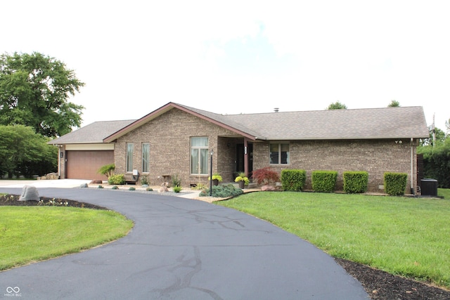 6022 S 550th Rd E, Franklin, IN 46131 - single story home with asphalt driveway, brick siding, and a front yard