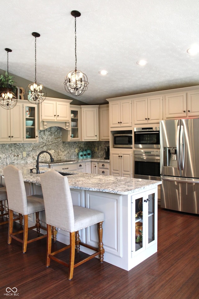 6022 S 550th Rd E, Franklin, IN 46131 - kitchen featuring a chandelier, stainless steel appliances, tasteful backsplash, decorative light fixtures, and lofted ceiling