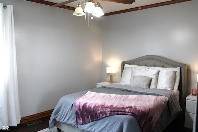 6022 S 550th Rd E, Franklin, IN 46131 - bedroom featuring wood finished floors, crown molding, and ceiling fan