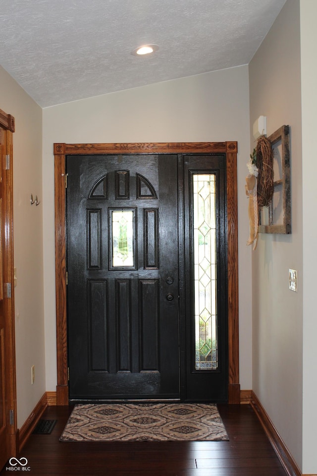 6022 S 550th Rd E, Franklin, IN 46131 - entryway featuring dark wood-type flooring and a textured ceiling