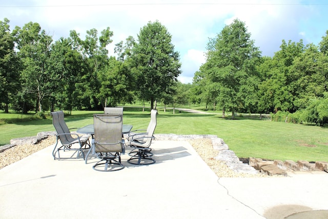 6022 S 550th Rd E, Franklin, IN 46131 - view of patio / terrace featuring outdoor dining area and view of wooded area